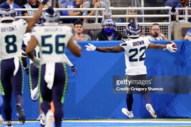 Tre Brown of the Seattle Seahawks returns an interception for a touchdown during the fourth quarter in the game against the Detroit Lions at Ford...