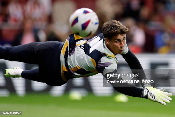 Real Madrid's Spanish goalkeeper Kepa Arrizabalaga warms up before the Spanish Liga football match between Club Atletico de Madrid and Real Madrid CF...