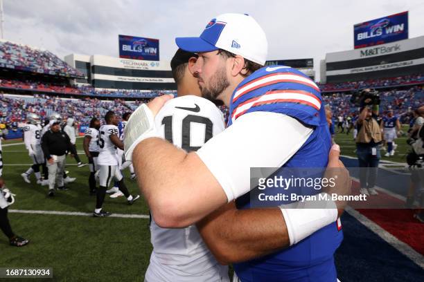 Jimmy Garoppolo of the Las Vegas Raiders and Josh Allen of the Buffalo Bills hug after Buffalo's 38-10 win at Highmark Stadium on September 17, 2023...
