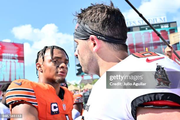 Justin Fields of the Chicago Bears talks to Baker Mayfield of the Tampa Bay Buccaneers after Tampa Bay's 27-17 win at Raymond James Stadium on...