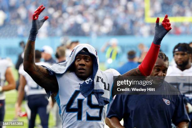 Arden Key of the Tennessee Titans celebrates after his team's 27-24 overtime win against the Los Angeles Chargers at Nissan Stadium on September 17,...