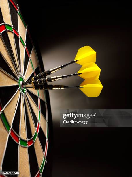 dartboard with three darts - bulls eye stock pictures, royalty-free photos & images