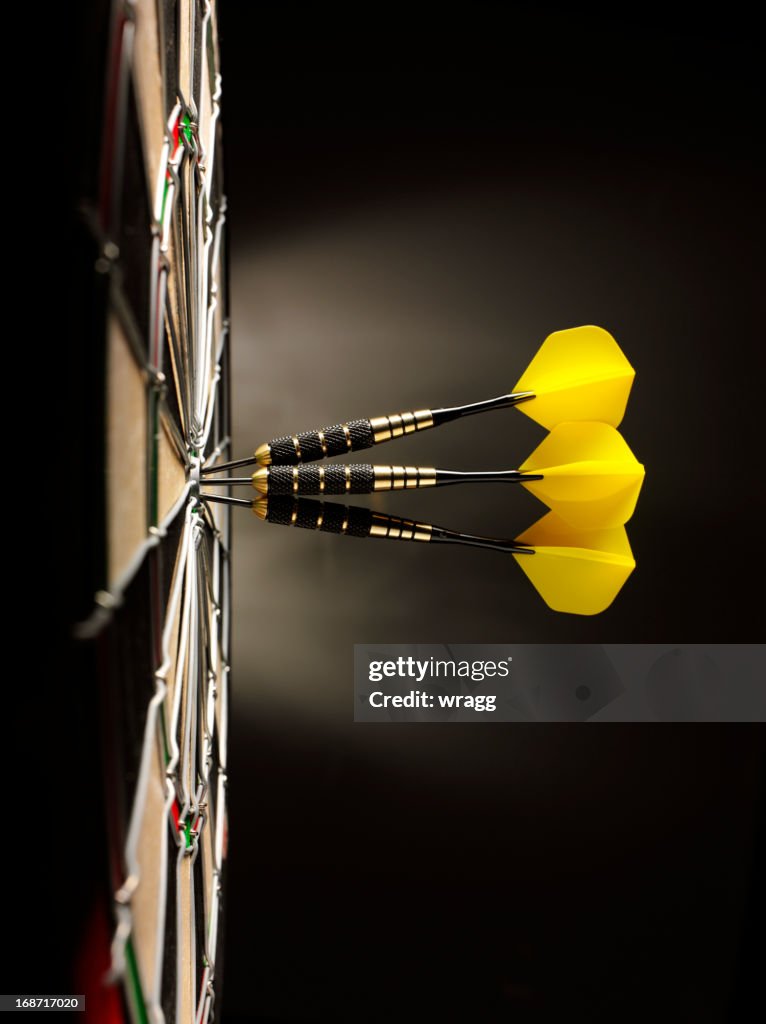 Three Yellow Darts in a Dartboard