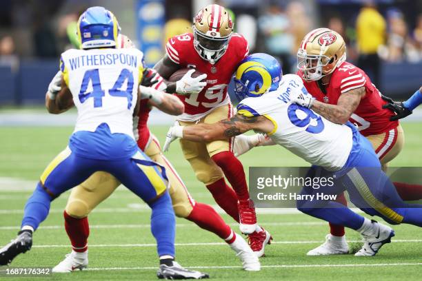 Deebo Samuel of the San Francisco 49ers is tackled by Michael Hoecht of the Los Angeles Rams during the first quarter at SoFi Stadium on September...
