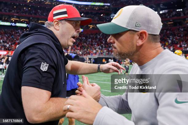 Head coach Arthur Smith of the Atlanta Falcons and head coach Matt LaFleur of the Green Bay Packers embrace after the game at Mercedes-Benz Stadium...