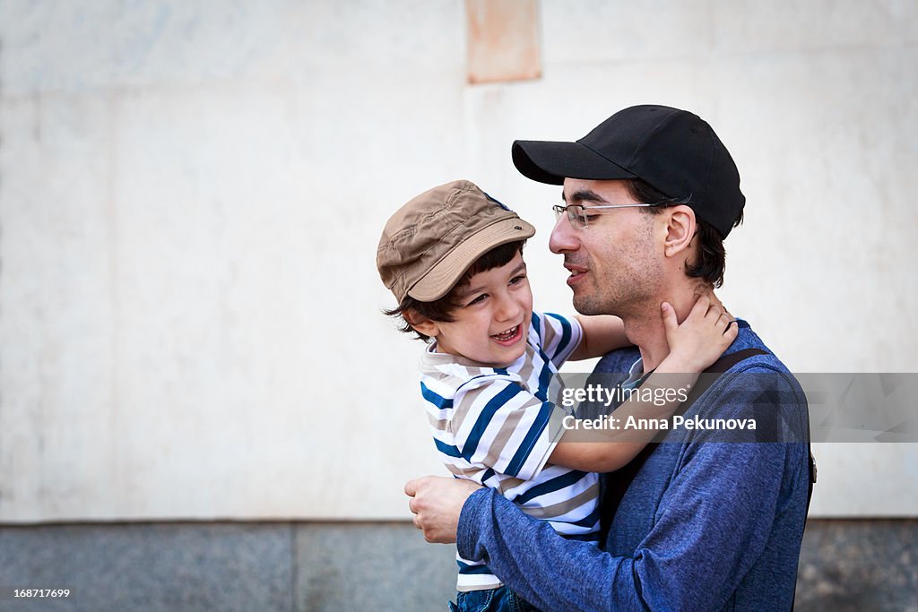 Father holding his son in his arms