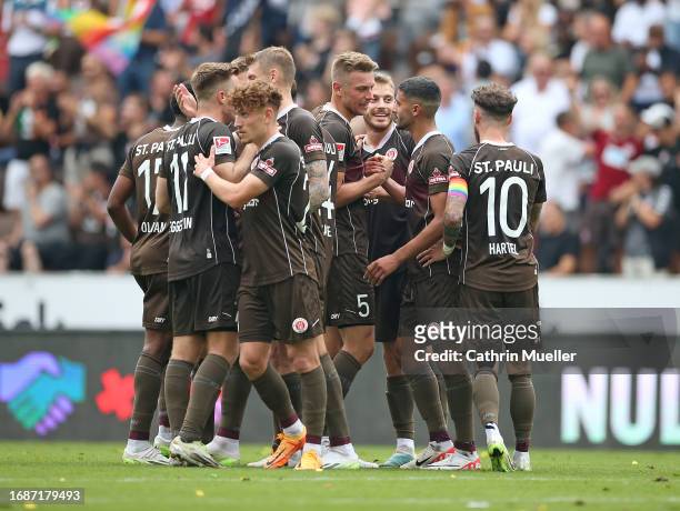 Lars Ritzka of FC St. Pauli celebrates with his teammates after scoring the team's fourth goal during the Second Bundesliga match between FC St....