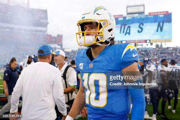 Justin Herbert of the Los Angeles Chargers looks on after his team's 27-24 overtime loss against the Tennessee Titans at Nissan Stadium on September...