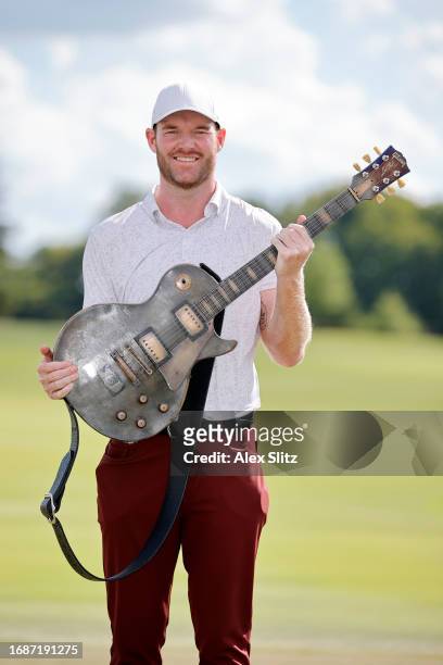 Grayson Murray of the United States with the trophy after winning the final round of the Simmons Bank Open for the Snedeker Foundation at The Grove...
