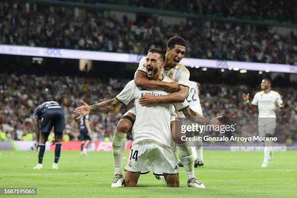 Joselu Mato of Real Madrid CF celebrates scoring their second goal with teammate Jude Bellingham during the LaLiga EA Sports match between Real...