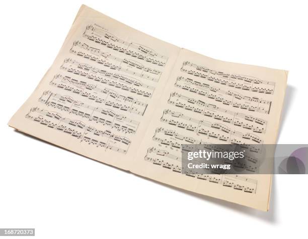 isolated sheet music - bladmuziek stockfoto's en -beelden