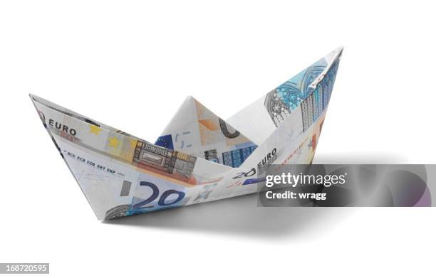 paper boat made from euros - origami stock pictures, royalty-free photos & images