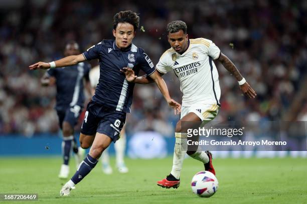 Takefusa Kubo of Real Sociedad battles for possession with Rodrygo of Real Madrid during the LaLiga EA Sports match between Real Madrid CF and Real...