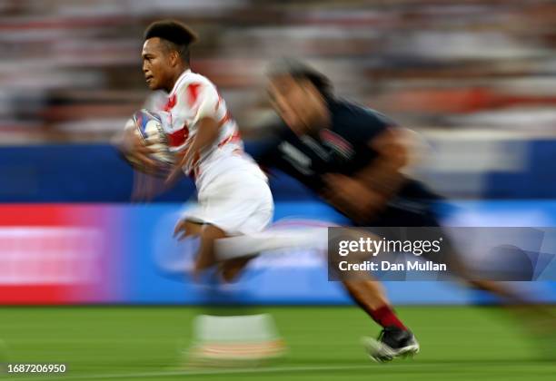 Kotaro Matsushima of Japan makes a breaks past Billy Vunipola of England during the Rugby World Cup France 2023 match between England and Japan at...