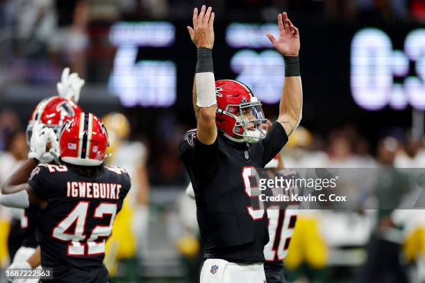 Desmond Ridder of the Atlanta Falcons reacts after a play during the fourth quarter in the game against the Green Bay Packers at Mercedes-Benz...