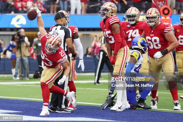 Christian McCaffrey of the San Francisco 49ers reacts to a touchdown during the first quarter against the Los Angeles Rams at SoFi Stadium on...