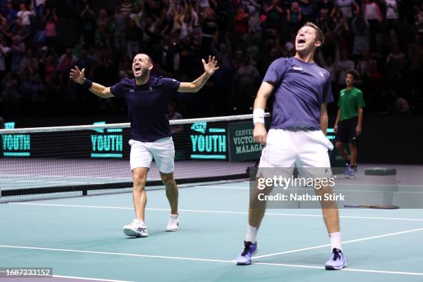 Daniel Evans and Neal Skupski of Great Britain celebrate winning against Nicolas Mahut and Edouard Roger-Vasselin of France during the Great Britain...