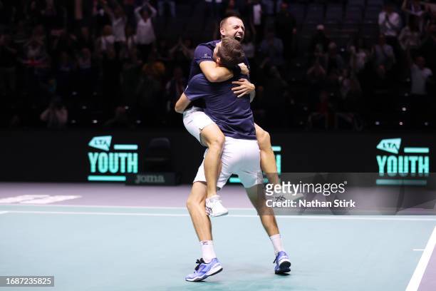 Daniel Evans and Neal Skupski of Great Britain celebrate winning against Nicolas Mahut and Edouard Roger-Vasselin of France during the Great Britain...