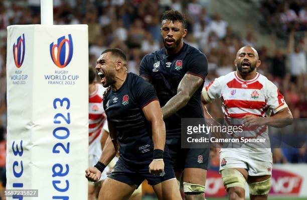 Joe Marchant of England celebrates with Courtney Lawes of England after scoring his team's fourth try during the Rugby World Cup France 2023 match...
