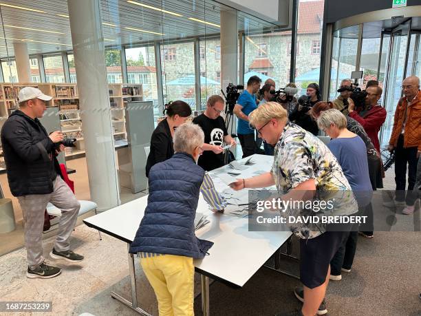 Ballots are counted on a table after closure of the voting during local elections day in the city library of Nordhausen, central Germany, on...