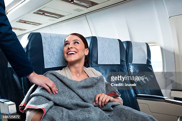 auf dem flugzeug - airline passengers stock-fotos und bilder