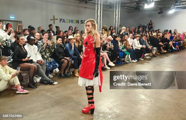 Alice Dellal walks the runway at the Pam Hogg show during London Fashion Week September 2023 at New Inn Yard on September 17, 2023 in London, England.