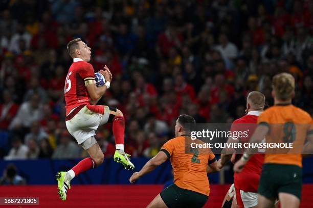 Wales' full-back Liam Williams grabsx the ball during the France 2023 Rugby World Cup Pool C match between Wales and Australia at the OL Stadium in...