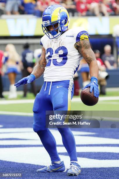 Kyren Williams of the Los Angeles Rams reacts after scoring a rushing a touchdown during the second quarter against the San Francisco 49ers at SoFi...