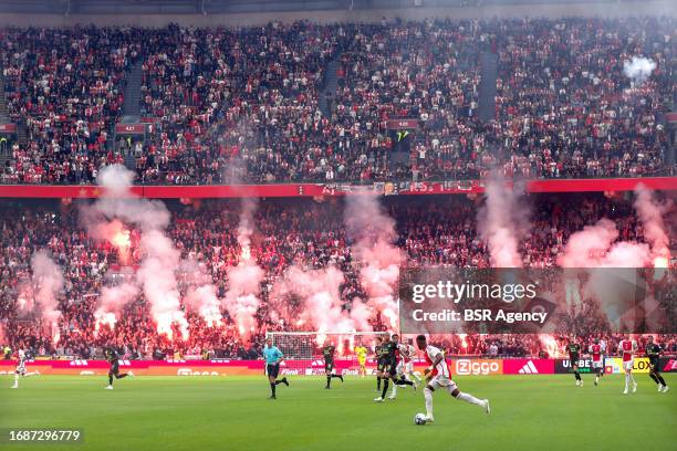 Fireworks during the Dutch Eredivisie match between Ajax and Feyenoord at Johan Cruijff ArenA on September 24, 2023 in Amsterdam, Netherlands.