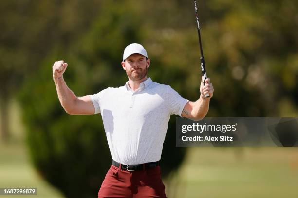 Grayson Murray of the United States celebrates after sinking a birdie putt on the 18th green during the final round of the Simmons Bank Open for the...