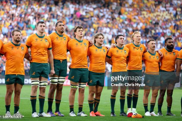 Players of Australia line up for the National Anthems prior to the Rugby World Cup France 2023 match between Australia and Fiji at Stade...
