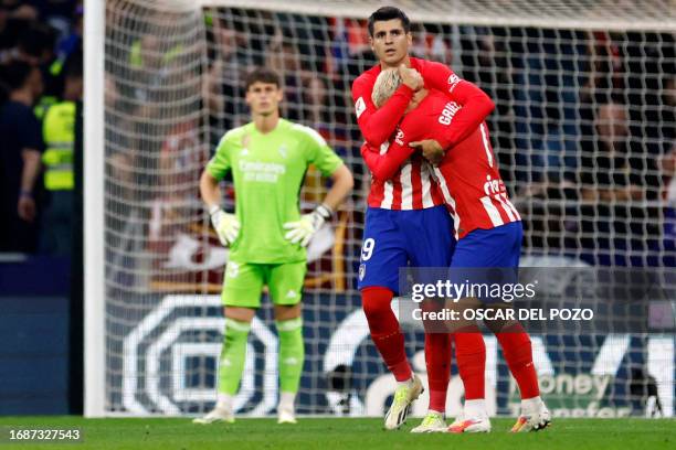 Atletico Madrid's French forward Antoine Griezmann is congratulated by Atletico Madrid's Spanish forward Alvaro Morata for scoring his team's second...