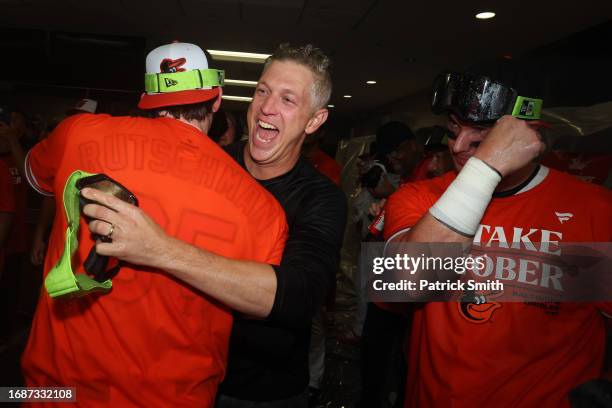 Executive Vice President and General Manager Mike Elias of the Baltimore Orioles celebrates in the clubhouse after his team clinched a 2023 MLB...