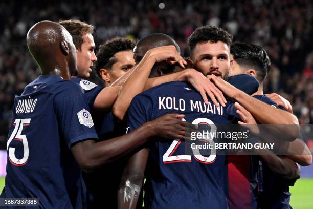 Paris Saint-Germain's Portuguese forward Goncalo Ramos celebrates with team mates after scoring a goal during the French L1 football match between...