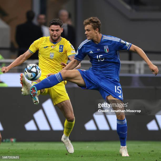 Giorgio Scalvini of Italy challenges Roman Yaremchuk of Ukraine during the UEFA EURO 2024 European qualifier match between Italy and Ukraine at...