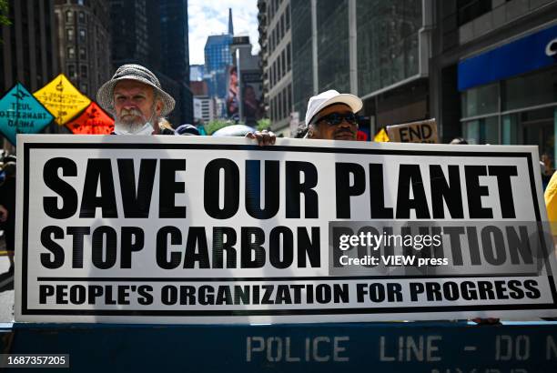 Climate activists attend the march against fossil fuels in midtown Manhattan on September 17, 2023 in New York City. The event in New York is part of...