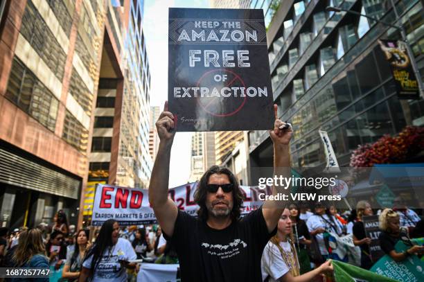 Climate activists attend the march against fossil fuels in midtown Manhattan on September 17, 2023 in New York City. The event in New York is part of...