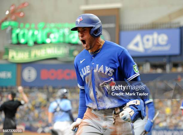 Toronto Blue Jays outfielder George Springer celebrates hitting a second inning three-run inside the park homerun against the Tampa Bay Rays at...