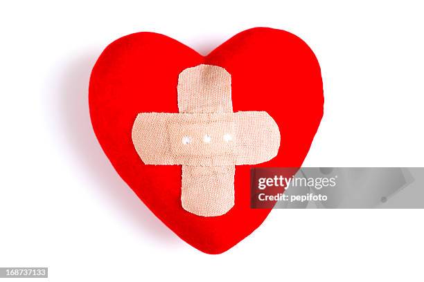 heart  with adhesive bandage - red crescent stock pictures, royalty-free photos & images