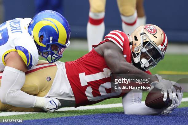 Deebo Samuel of the San Francisco 49ers scores a touchdown during the fourth quarter against the Los Angeles Rams at SoFi Stadium on September 17,...