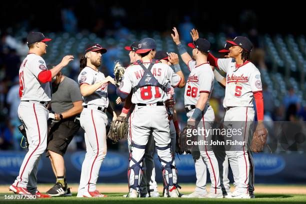 Washington Nationals celebrate a 2-1 win in 11 innings against the Milwaukee Brewers at American Family Field on September 17, 2023 in Milwaukee,...
