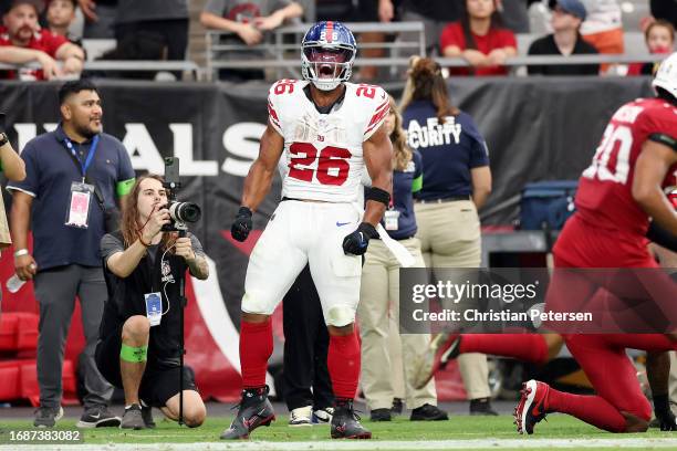 Saquon Barkley of the New York Giants celebrates a touchdown during the fourth quarter in the game against the Arizona Cardinals at State Farm...