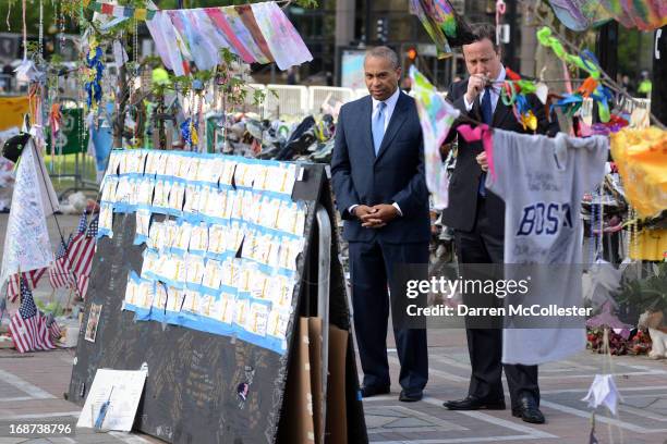 Prime Minister David Cameron and Massachusetts Governor Deval Patrick visit the memorial to the Boston Marathon bombing victims on Boylston Street on...