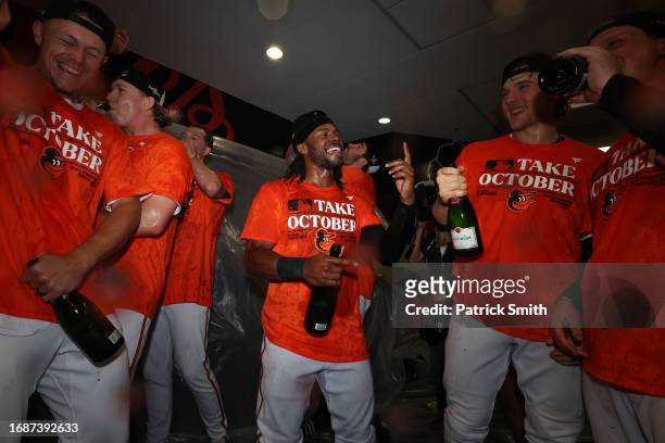Cedric Mullins of the Baltimore Orioles celebrates in the clubhouse after the Baltimore Orioles clinched a 2023 MLB playoff berth after defeating the...