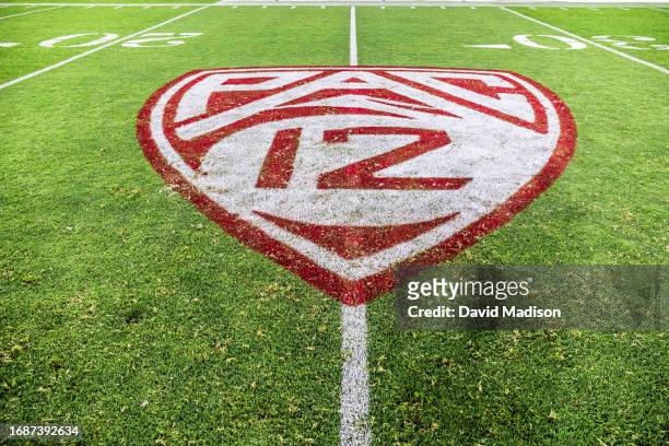 View of the Pac-12 logo on the field at Stanford Stadium during an NCAA college football game between the Stanford Cardinal and the Sacramento State...