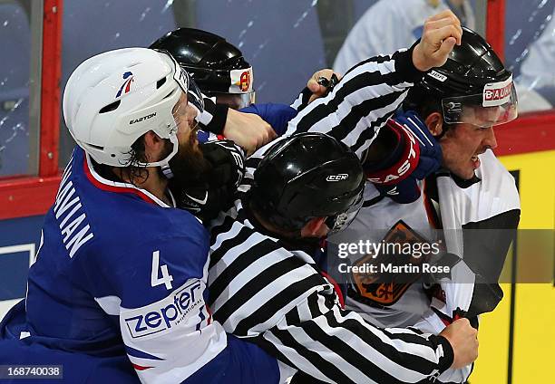 Antonin Manavian of France and John Tripp of Germany fight during the IIHF World Championship group H match between France and Germany at Hartwall...