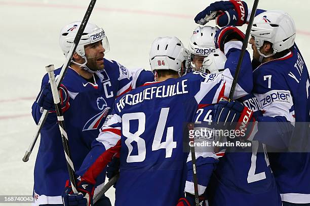 Team members of France celebrate their openin goal during the IIHF World Championship group H match between France and Germany at Hartwall Areena on...