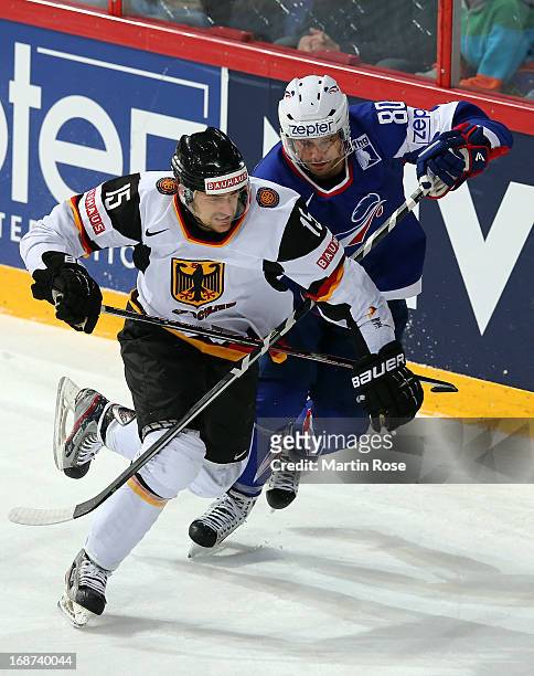 Teddy da Costa of France skates against Jens Baxmann of Germany during the IIHF World Championship group H match between France and Germany at...