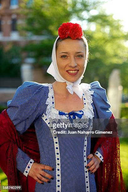 Woman dressed in chulapo looks on during the festivities on May 14, 2013 in Madrid, Spain. These festivities are in honor of San Isidro Labrador and...