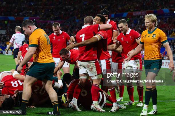 Jac Morgan of Wales celebrates scoring his sides third try with team mate Rio Dyer during the Rugby World Cup France 2023 match between Wales and...
